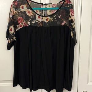 3X. bottom of shirt is stretchy t-shirt material and top is sheer
